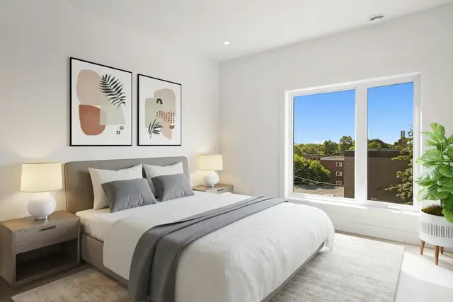 Dormitorio con ventana y vista a los árboles