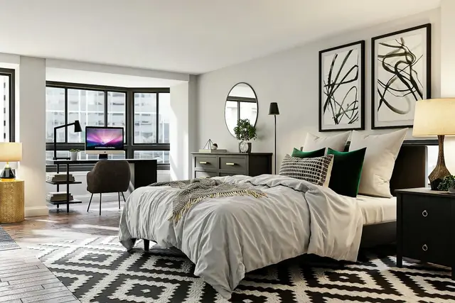 Dormitorio con escritorio y alfombra